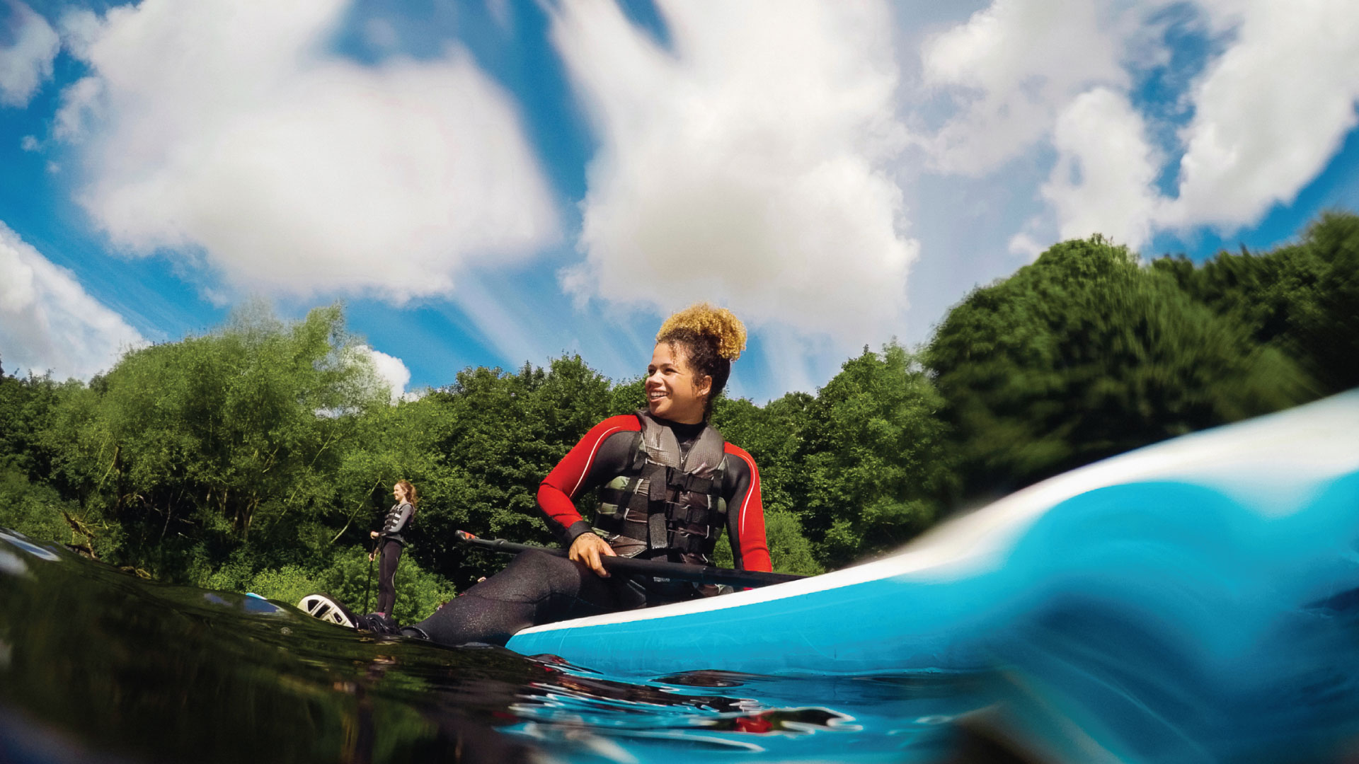 A woman paddleboarding