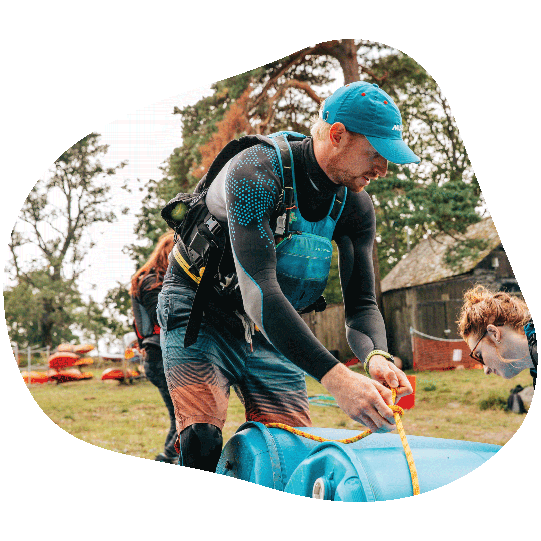 A man tieing barrels togther